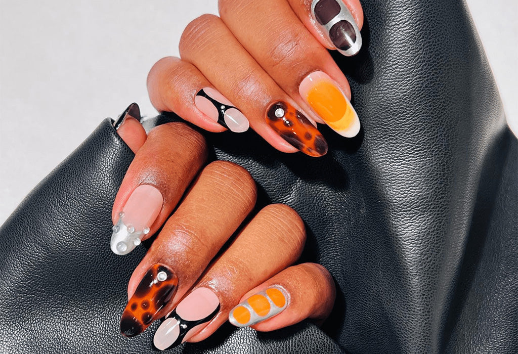 Live It Up Now with Black and Orange Nail Designs